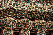 Bangkok Wat Pho, the group of the chedi of the four kings, detail of multicolored mosaic flowers made from Chinese ceramic bowls cut into petal shapes. 